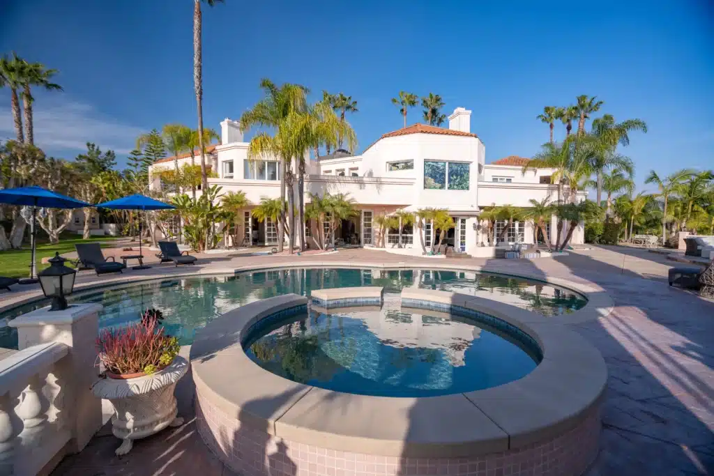 Zoomed out shot of our Villa Oasis backyard pool and jacuzzi