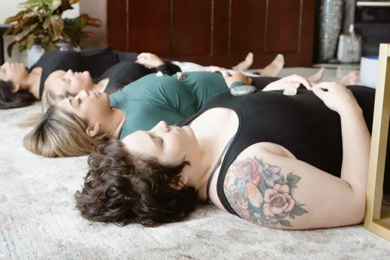 Relaxation therapy at Villa Oasis. Residents are laying on the floor meditating