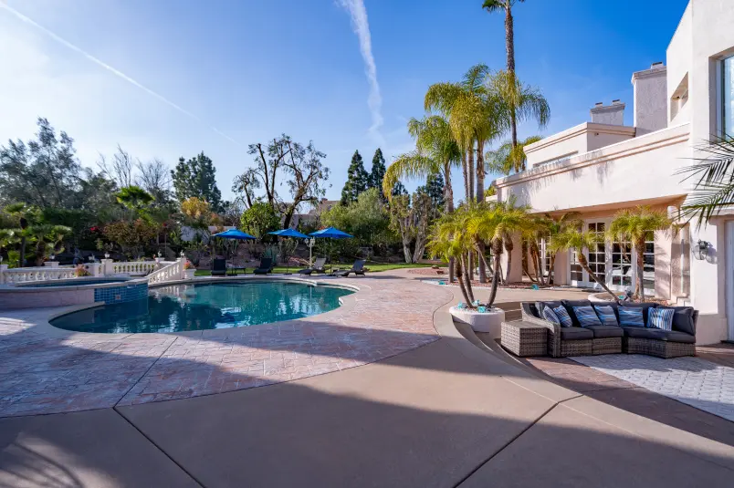 Villa Oasis pool view with couches