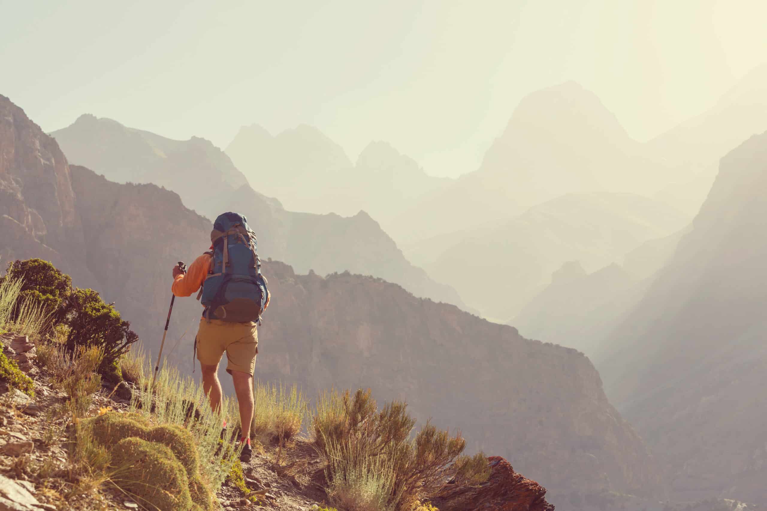 Wanderlust time. Man hiking in beautiful Fann mountains in Pamir, Tajikistan. Central Asia.